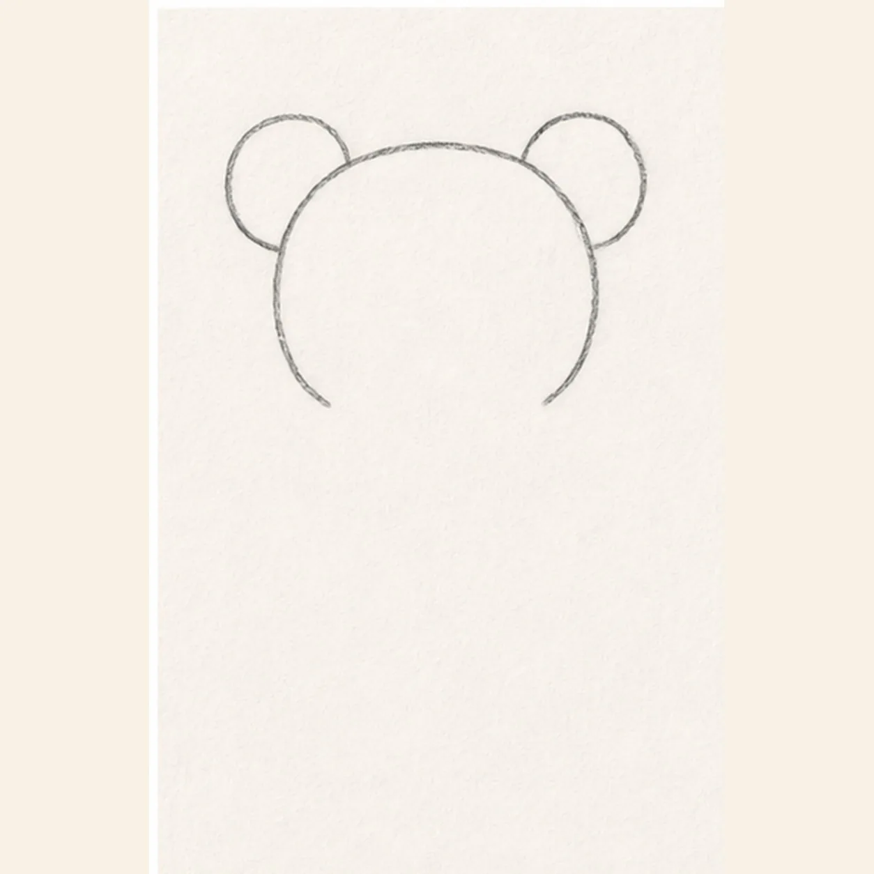 Draw the head and ears stage for how to draw a patched teddy bear